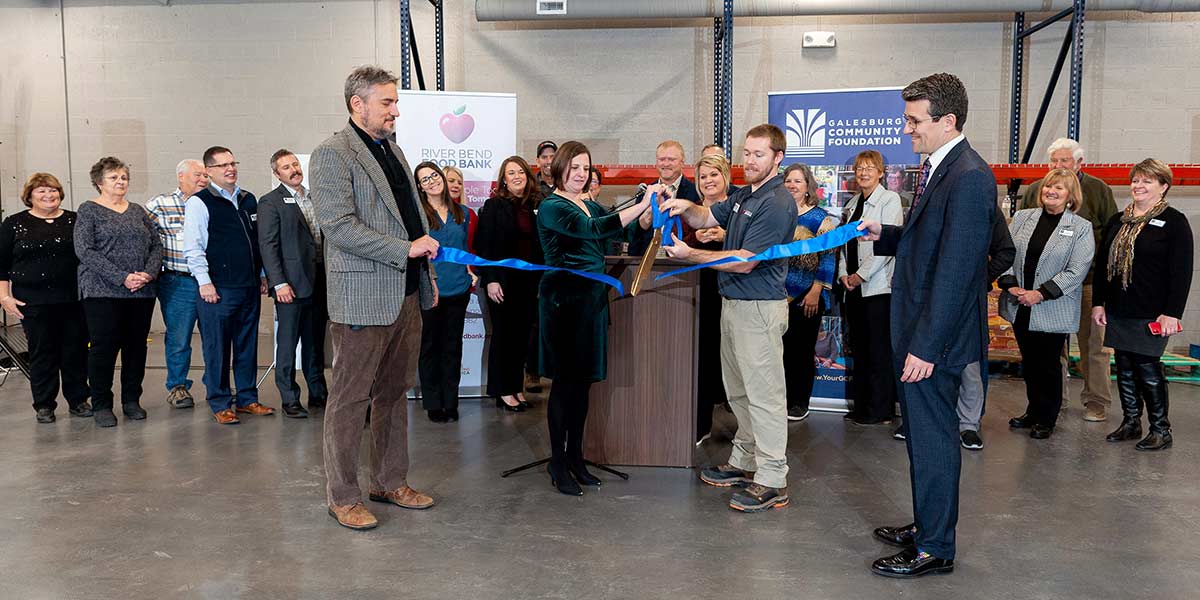 The community gathers for a ribbon-cutting at the new River Bend Food Bank, Galesburg Branch