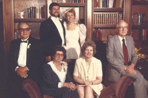 Nick Poulos and his wife Barbara at their wedding in 1988. Seated are, from left, Peter and Alice Poulos and Betty and Harry Taif.