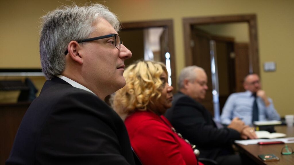 State Senator Mike Halpin; his aide, Debra Grey-Gibson; and State Representative Dan Swanson. 