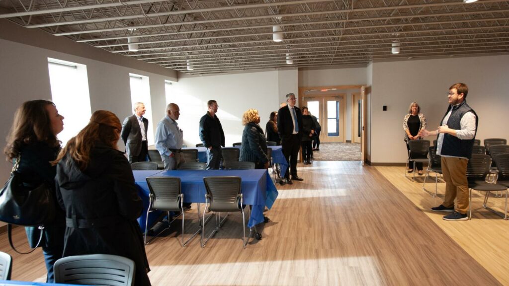 Lucas Wood, Executive Director of the Knox-Galesburg Symphony, takes the group on a tour of the newly renovated performance space at the Symphony Center.