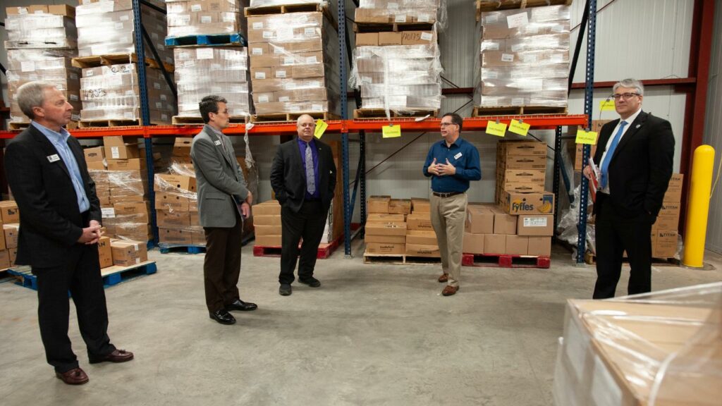 Chris Ford, Chief Operating Officer of River Bend Food Bank, takes the group on a tour of the Galesburg Branch.