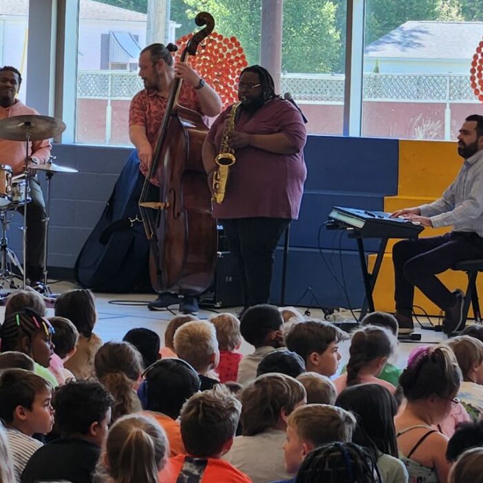 Children gather to listen to jazz professionals play at the Rootabaga Jazz Festival, which is supported through a grant from Galesburg Community Foundation's The Turnout.