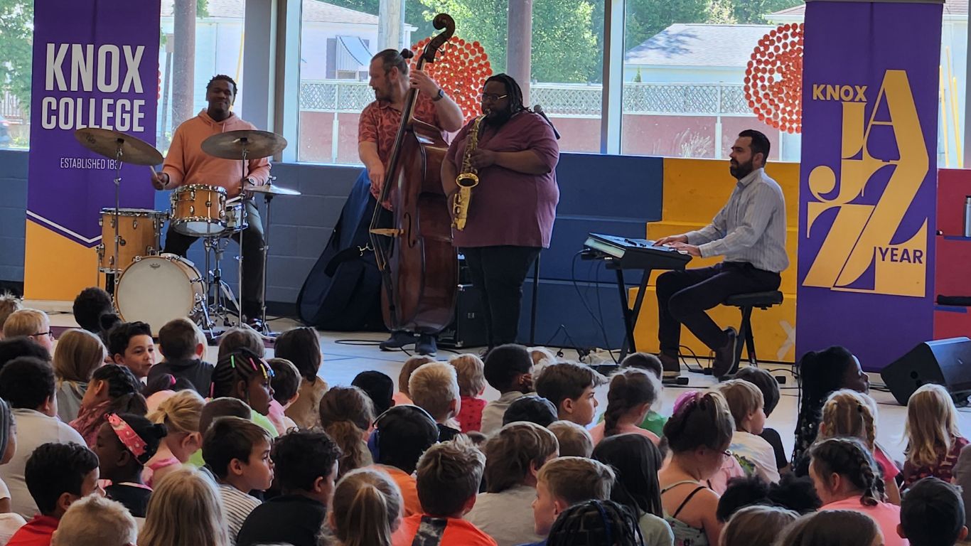 Children gather to listen to jazz professionals play at the Rootabaga Jazz Festival, which is supported through a grant from Galesburg Community Foundation's The Turnout.
